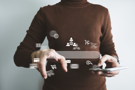 Search Engine optimization SEO concept, Businesswoman is using smartphone to search for information on Internet, Using the search bar, Wireless Network, big data and accessing website information.の写真素材