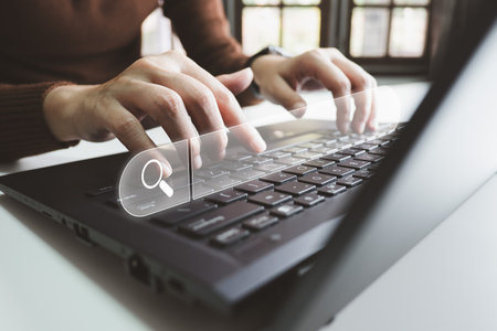 SEO Search engine optimization, Search technology, women's hands using a computer keyboard to search for information, using websites search bar to find the desired information or shopping online.の写真素材