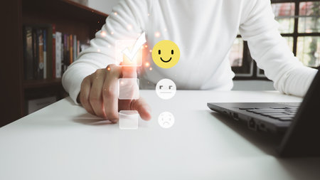 Concept of customer satisfaction and service, businesswoman using laptop to express their opinions, answers and satisfied scores.の写真素材