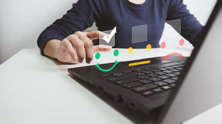 Concept of customer satisfaction and service, businesswoman using laptop to express their opinions, answers and satisfied scores.の写真素材
