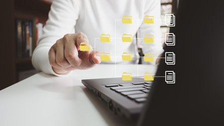 Officer using laptop manage files, Document Management System DMS, Online document database management, automated processes to manage system, ERP enterprise efficient, business technology.の写真素材