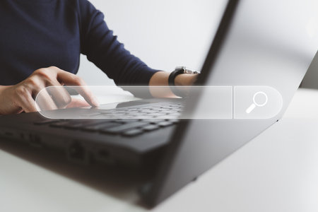 SEO Search engine optimization, Search technology, women's hands using a computer keyboard to search for information, using websites search bar to find the desired information or shopping online.の写真素材