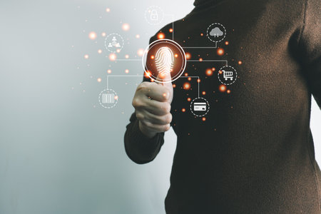 Person touching screen to fingerprint scanner, security access information, big data management concept, Internet of things, cloud computing, internet connection, shopping online and cashless society.の写真素材