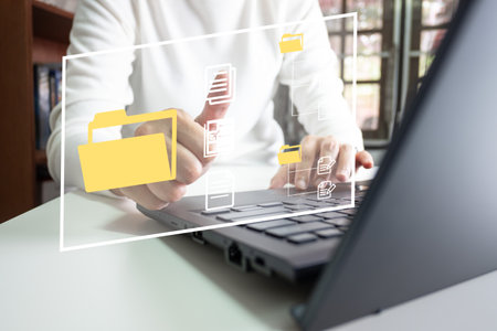 Officer using laptop manage files, Document Management System DMS, Online document database management, automated processes to manage system, ERP enterprise efficient, business technology.の写真素材