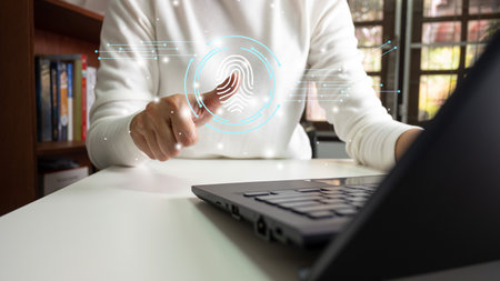 Person touching screen to fingerprint scanner, security access information, big data management concept, Internet of things, cloud computing, internet connection, shopping online and cashless society.の写真素材