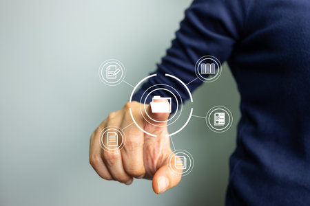 Business woman use finger touch screen folder manage file,online data management,Document Management System DMS,access to document file with security,structure design document,ERP enterpriseの写真素材