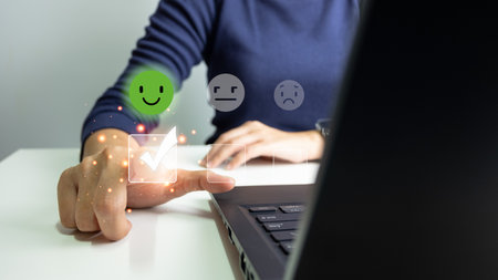 Customer satisfaction very good service with smart phone, impression of take care and attention, choose a smiley face icon, answer the survey, give the highest score, very happy feedback from guest.の写真素材