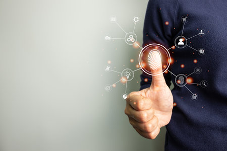 Person touching screen to fingerprint scanner, security access information, big data management concept, Internet of things, cloud computing, internet connection, shopping online and cashless society.の写真素材