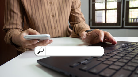 Search engine optimization SEO , Search technology, using laptop to search for information, using websites search bar to find the desired information or shopping onlineの写真素材