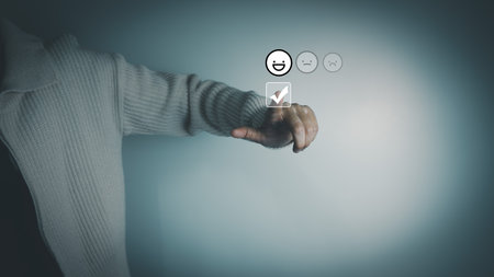 Satisfaction concept of customer, express their opinions, answers and satisfied scores, client is satisfied with pressing smile face icon, excellent service, good feedback from userの写真素材