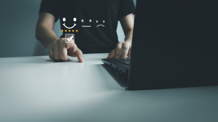 Satisfaction concept of customer, express their opinions, answers and satisfied scores, client is satisfied with pressing smile face icon, excellent service, good feedback from userの写真素材