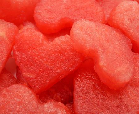Water melon cut into heart shape.の写真素材