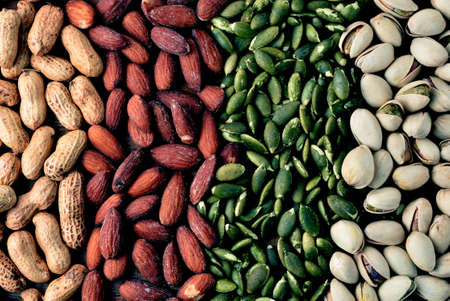 Nuts and dried fruits on vintage wooden boards still lifeの写真素材