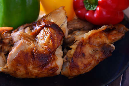 Grilled chicken legs with chips and vegetables