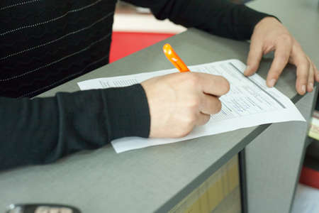 the man gives the car to repair.の写真素材