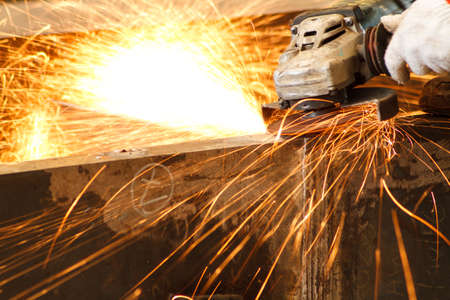 Electric grinding wheel on steel structure in factoryの写真素材