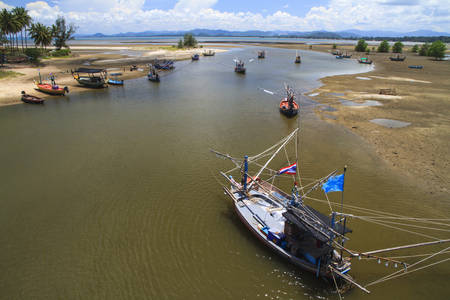 Harbor for park small fishing boats at low tide