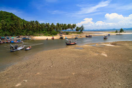 Harbor for park small fishing boats at low tideの写真素材