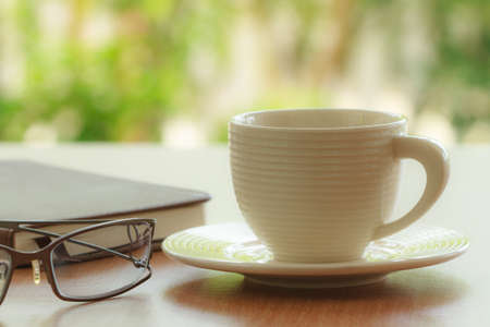 Cup of coffee with glass on morning timeの写真素材
