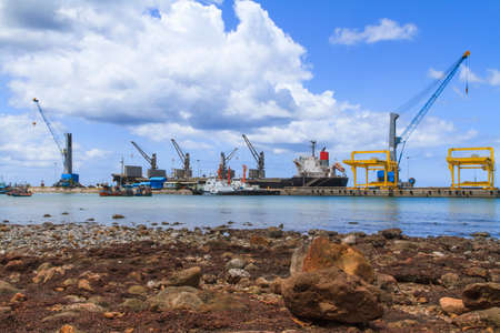 Ship yard with heavy crane at rock beachの写真素材