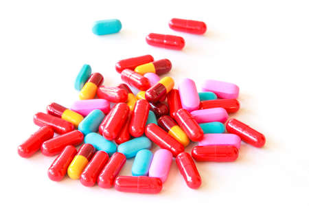 Various pills on white background
