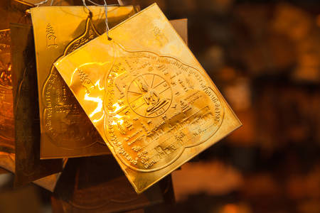 Buddha pump on golden plateの写真素材