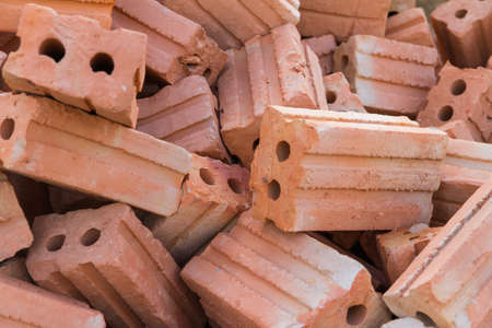 Pile of red brick as background