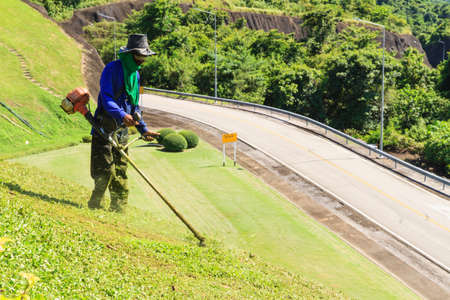 Men mow on the mountain