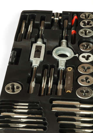 Professional mechanical hand tool set . Tap and die nuts for metal processing.の写真素材