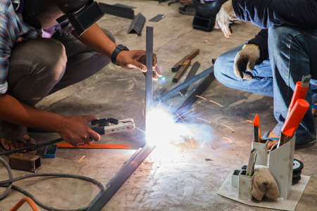worker without welding protective gloves welding metal - Conditions Hazardous Working.