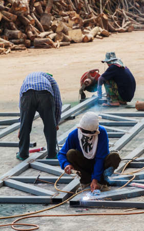 Worker Without Welding Protective Gloves Welding Metal - Conditions Hazardous Working.のeditorial素材