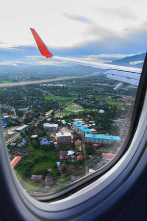 Landscape and city view of window at flying airplane.の写真素材