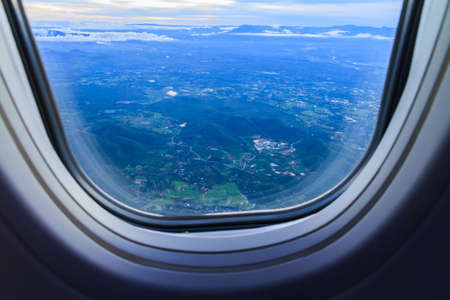 Landscape view of window at flying airplane.の写真素材