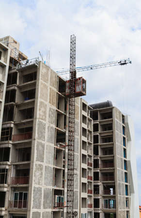 Crane and building construction site work.