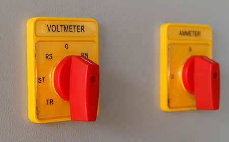 Volt meter switching button on electric control panel.の写真素材