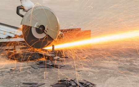 Sparks fire from while cutting steel.