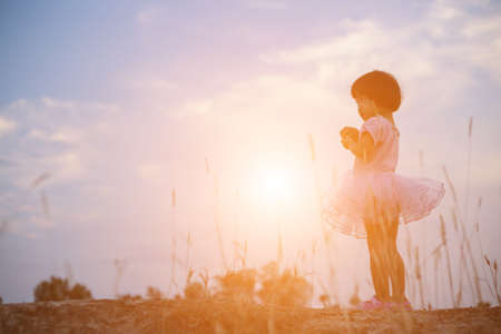 A girls playing in the gardenの写真素材