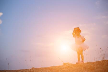 A girl playing in the gardenの写真素材