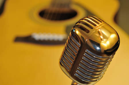 Retro golden microphone, guitar backgroundの写真素材