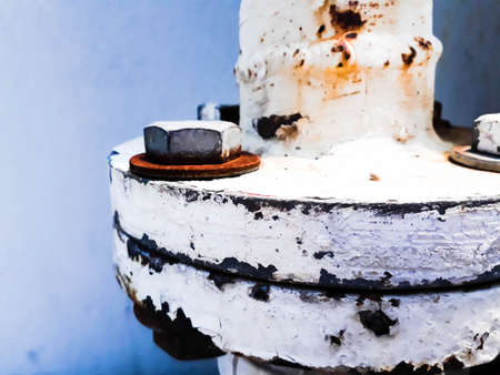 joint of two flanges by bolts and nuts, Bolts base Blurred soft focus,  Fastening base column, Old rusty steel nutの写真素材