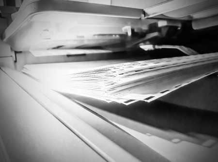 white paper sheets on the printer in office.with copy space, Office work : Close up office employee at work, put paper in office copierの写真素材