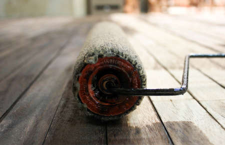 Staining a piece of timber with a roller, Painting Brown Colour With roller On timber