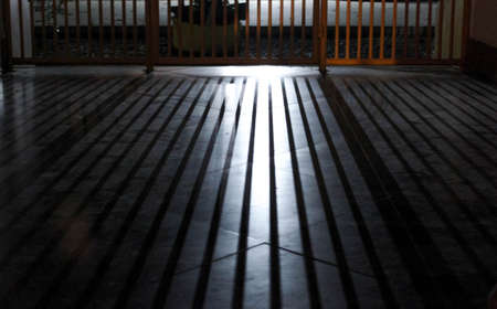Light headlights through the fenceの写真素材