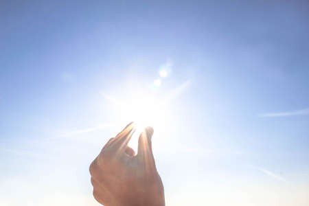 hand sun and blue sky with copyspace, hand sun and blue sky with copyspace for text messageの写真素材
