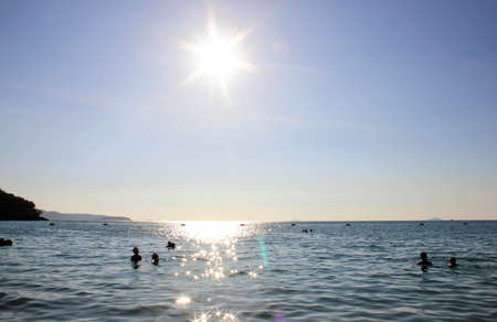 sunset over the sea, beach, Beach full sun, the sun and the sea, Paddle Boarding the afternoon away. A great way to stay fit and healthy with this exciting new sport.の写真素材