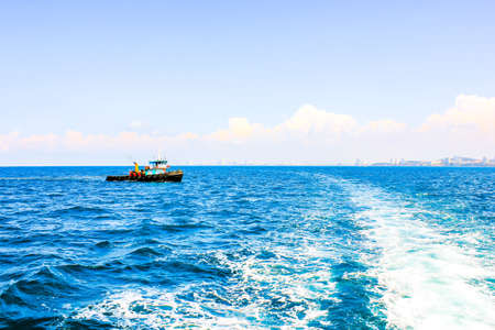 Fishing boat on the sea, Fishing boat on the sea with blue sky and white clouds.Thailand.の写真素材