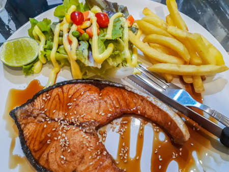 Grilled salmon and vegetables, Salmon fish fillet grilled steak, grilled salmon with sauce lemon and...