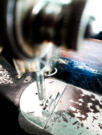 Close up - Old sewing machine, sewing machine and item of clothing, The old sewing machine. Vintage