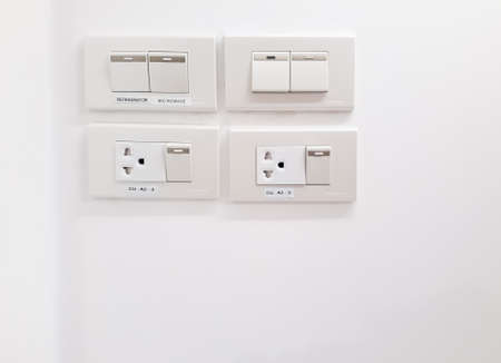 Switches, Wall Plug for electric, White electric socket on the wall, Switches and power outlets in the house, socket and switches set on white backgroundの写真素材
