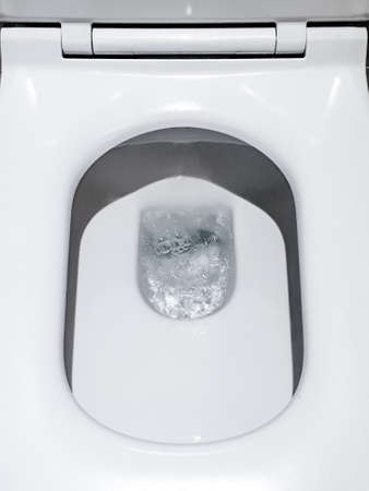 Toilet, Flushing Water, flush toilet, Closeup look at toilet, white toilet, White toilet in the...